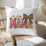 Glamorous MAMA pillow with pink and gold glitter and hearts.