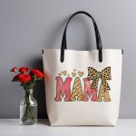 Trendy MAMA tote bag with glitter and leopard accents.