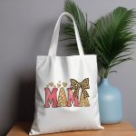 Chic MAMA tote bag with glitter text and hearts.