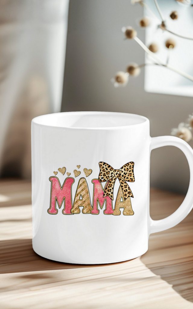 Pink and gold glitter MAMA text on a mug with leopard bow.