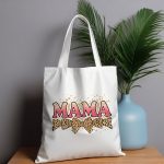 Chic MAMA tote bag with glitter text and splatter design.