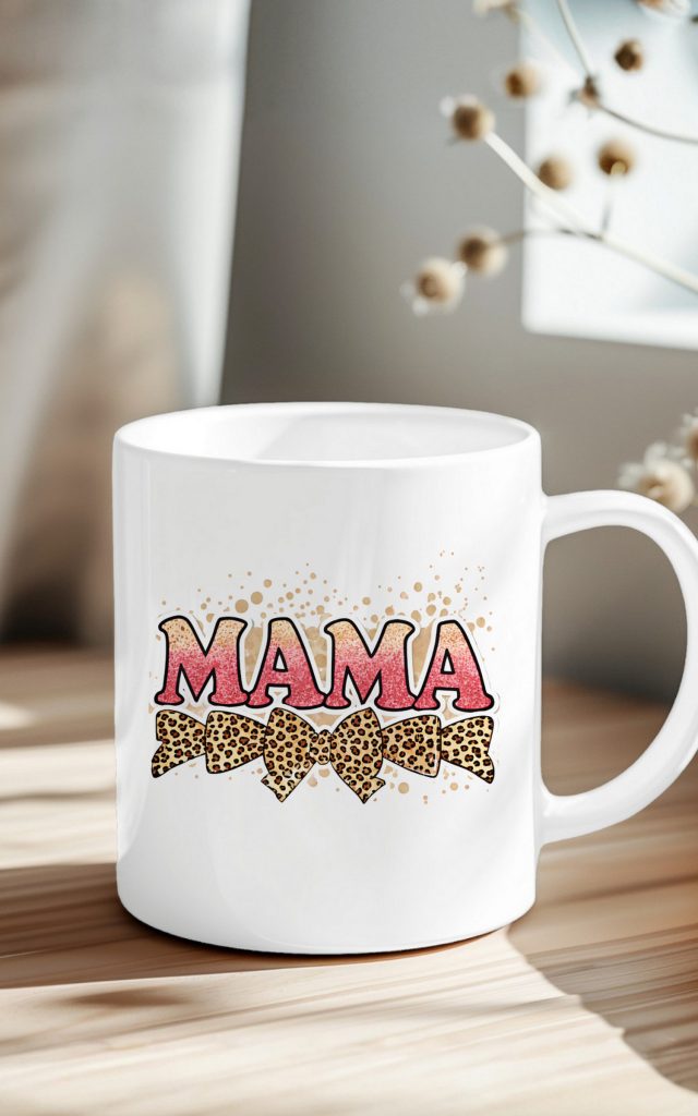 Pink glitter MAMA text on a mug with leopard bows.