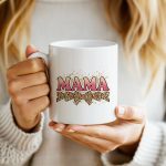 Bold MAMA mug with glitter text and splatter background.