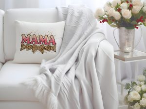 Pink glitter MAMA text on a pillow with leopard bows and splatter design