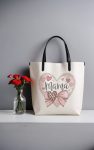 Elegant Mama tote bag with heart design and bow.