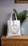 Delicate Mama tote bag with roses, pearls, and pastel tones.