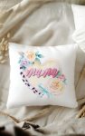 Pillow mockup featuring a watercolor design with 'Mama' in pink script on a pastel heart, surrounded by roses and leopard print