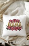 A decorative pillow with a floral "Mama" design, showcasing elegant gold letters and soft pink peonies.